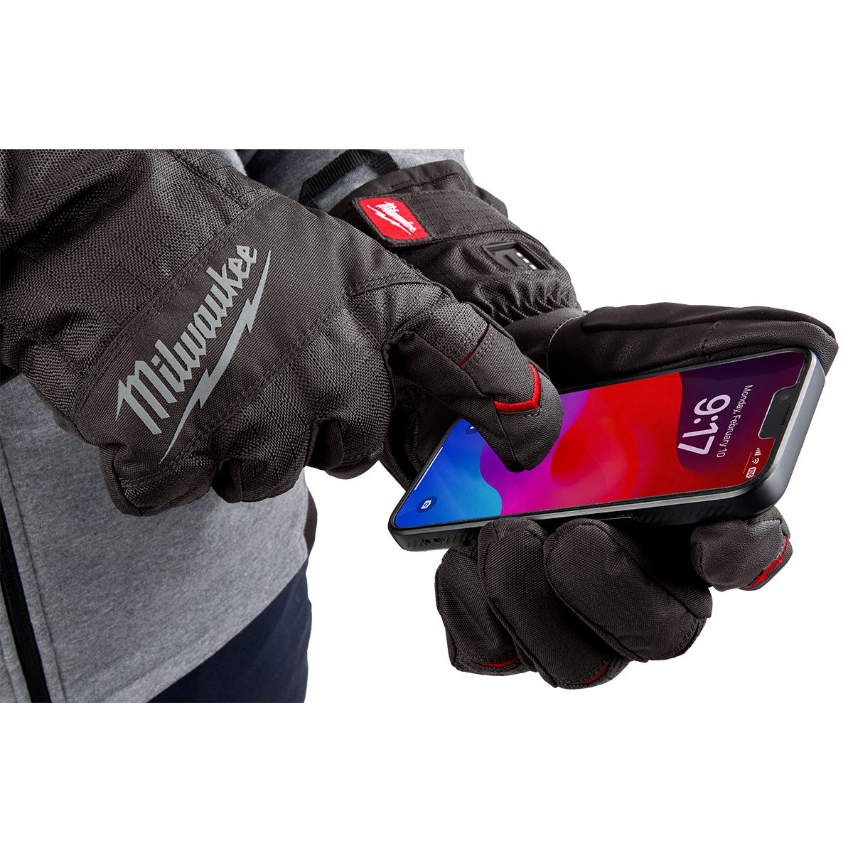 Black XL Milwaukee heated winter gloves with touchscreen-compatible fingertips and HEXON heating technology