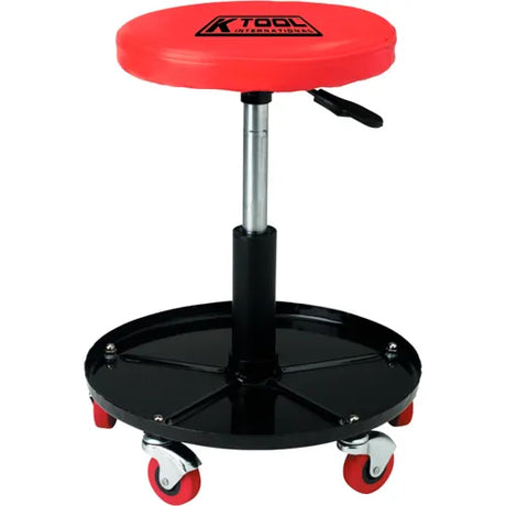 Adjustable mechanic stool with red cushioned seat, black steel base tray, and swivel casters for mobility and durability