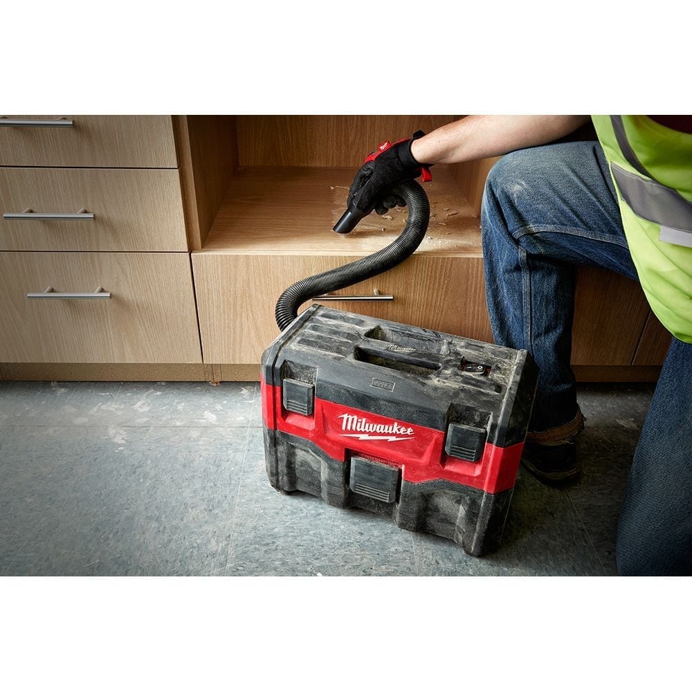 Portable Milwaukee M18 2-gallon wet and dry vacuum with flexible hose for powerful dust and water cleanup