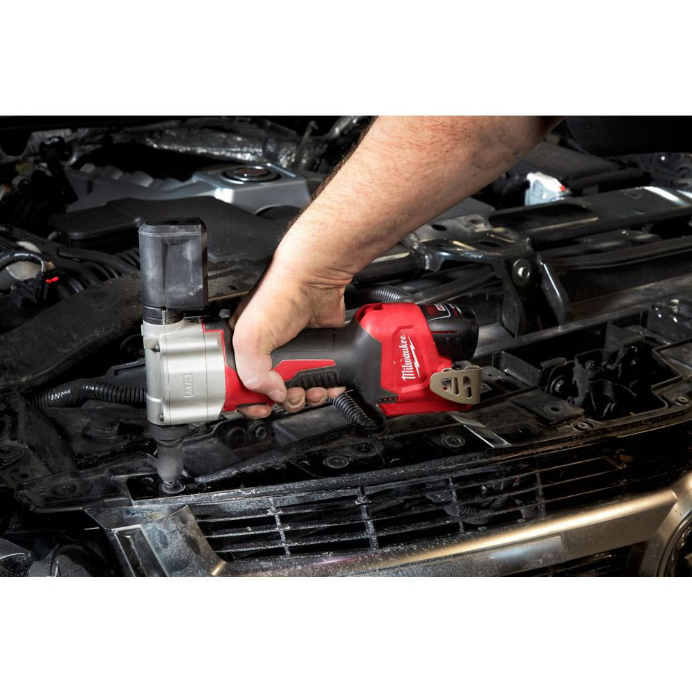 Milwaukee M12 12V cordless rivet tool with ergonomic grip, used for automotive metal fastening tasks
