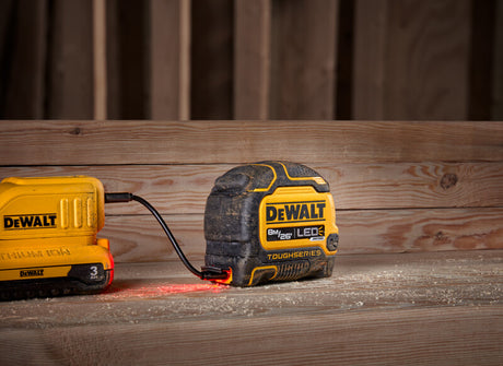 26ft Dewalt ToughSeries measuring tape with integrated LED light and durable black and yellow casing