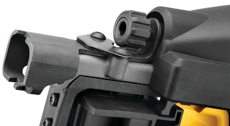 Close-up of a cordless rural fencing stapler showing metal magazine, adjustment knob, and yellow battery housing.
