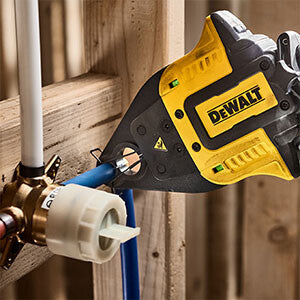 Yellow and black DEWALT PEX crimping tool with ergonomic grip used for 1/2"-3/4" pipe fittings in plumbing applications