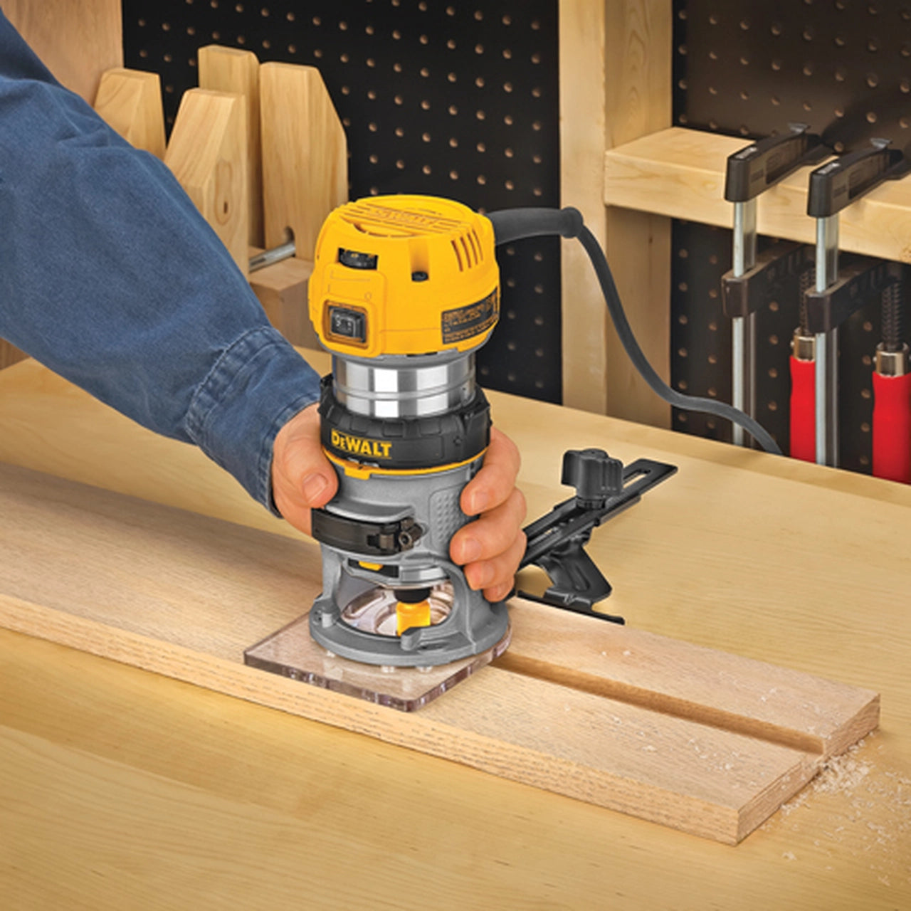 Compact variable-speed Dewalt 1.25 HP router with LED lights, ergonomic grip, and precision woodcutting baseplate