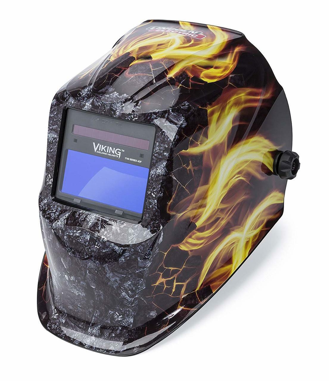 Auto-darkening welding helmet with black cracked design and yellow flame graphics, adjustable side knob control