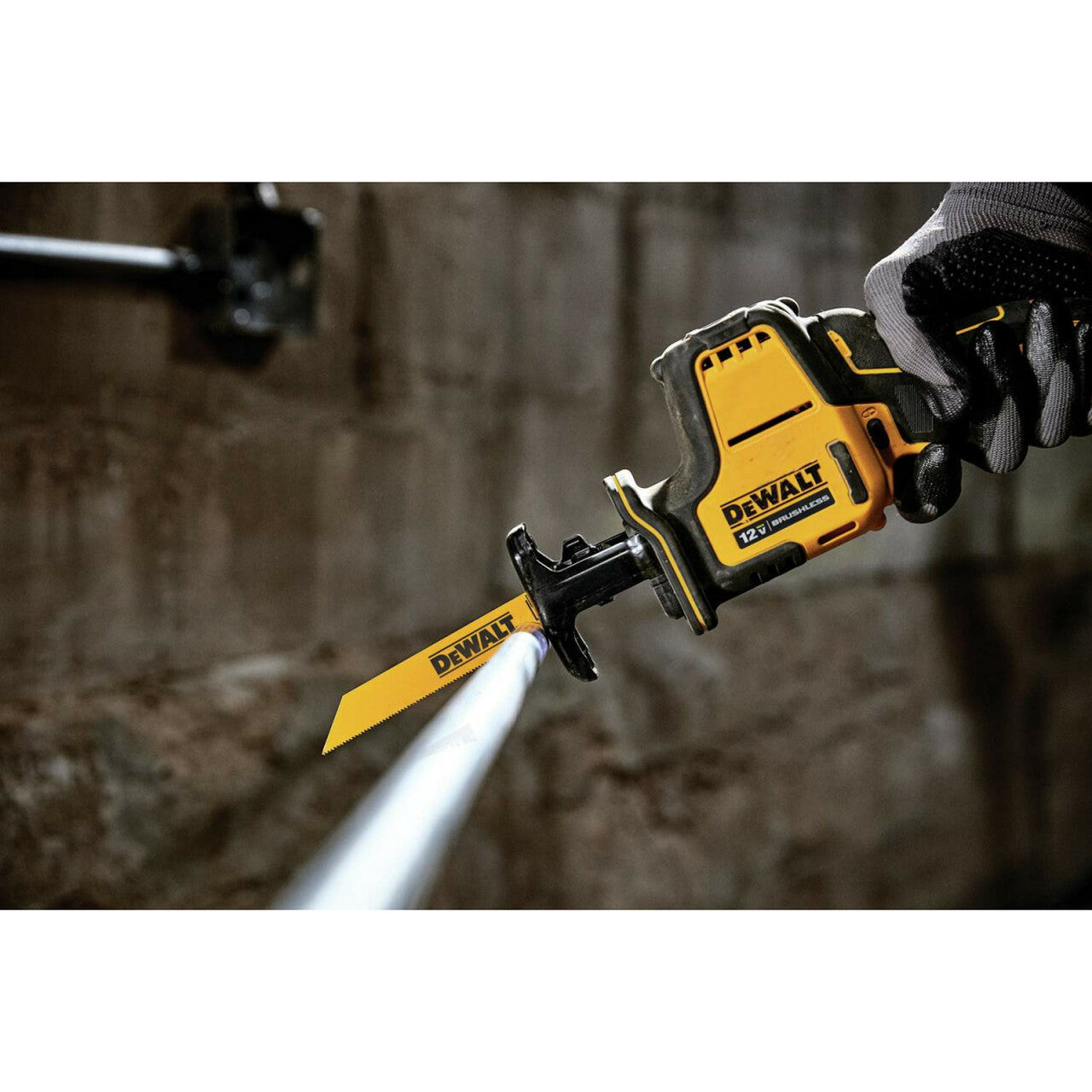 Cordless DeWalt 12V reciprocating saw with yellow blade, ergonomic grip, and variable speed trigger for cutting tasks