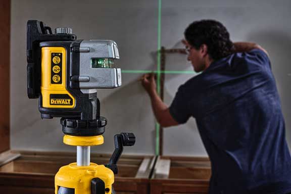 DeWalt DW089K laser level with green triple beam on tripod, ideal for precise 90-degree layout and measurements