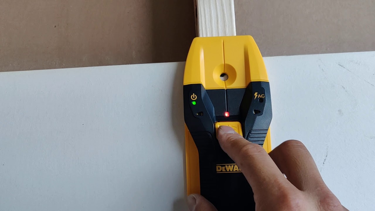 Yellow and black stud detector with central detection and LED indicators for wood and metal studs up to 3/4 inch deep